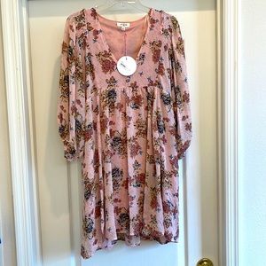 Short pink/lined dress with a beautiful floral design. Size medium. New